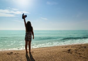 Girl at beach for a digital detox